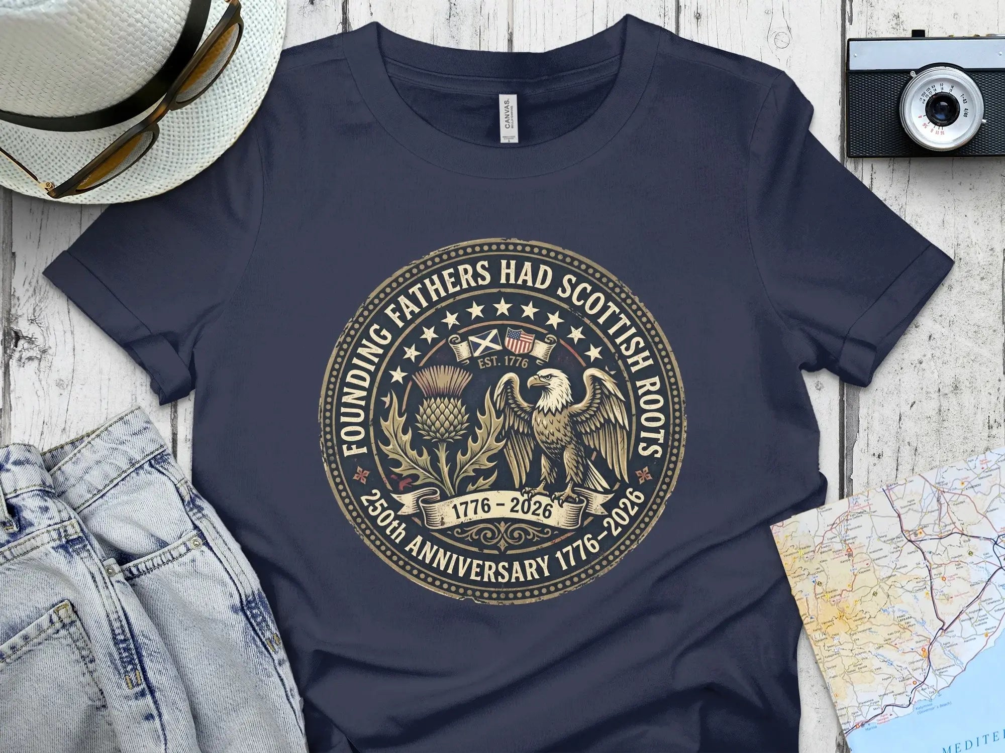 Navy t-shirt with "Founding Fathers Had Scottish Roots" circular emblem.