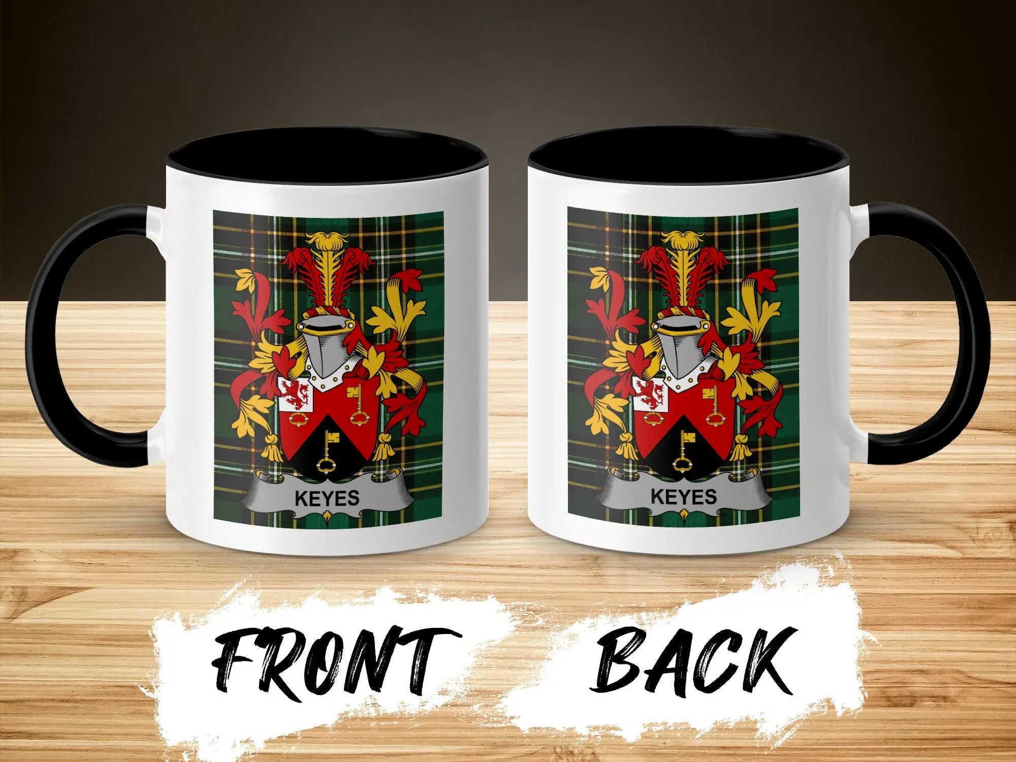 Mug with Keyes crest on front and back, black handle, on a wooden surface.