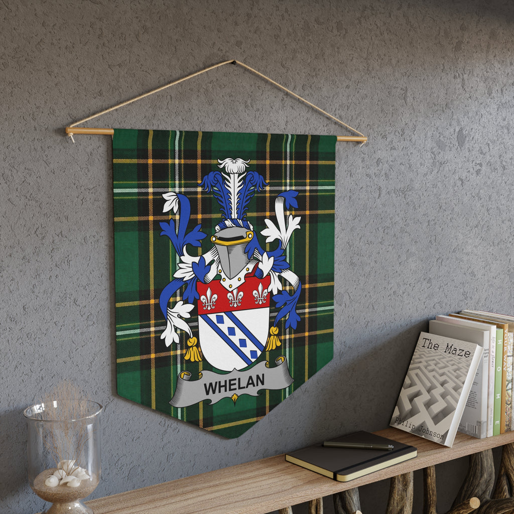 Whelan family crest on green plaid banner hanging on a wall.