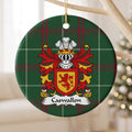 Caswallon ornament hanging from a pale wooden branch; a red upright lion on a gold shield with a red border on Welsh national tartan.