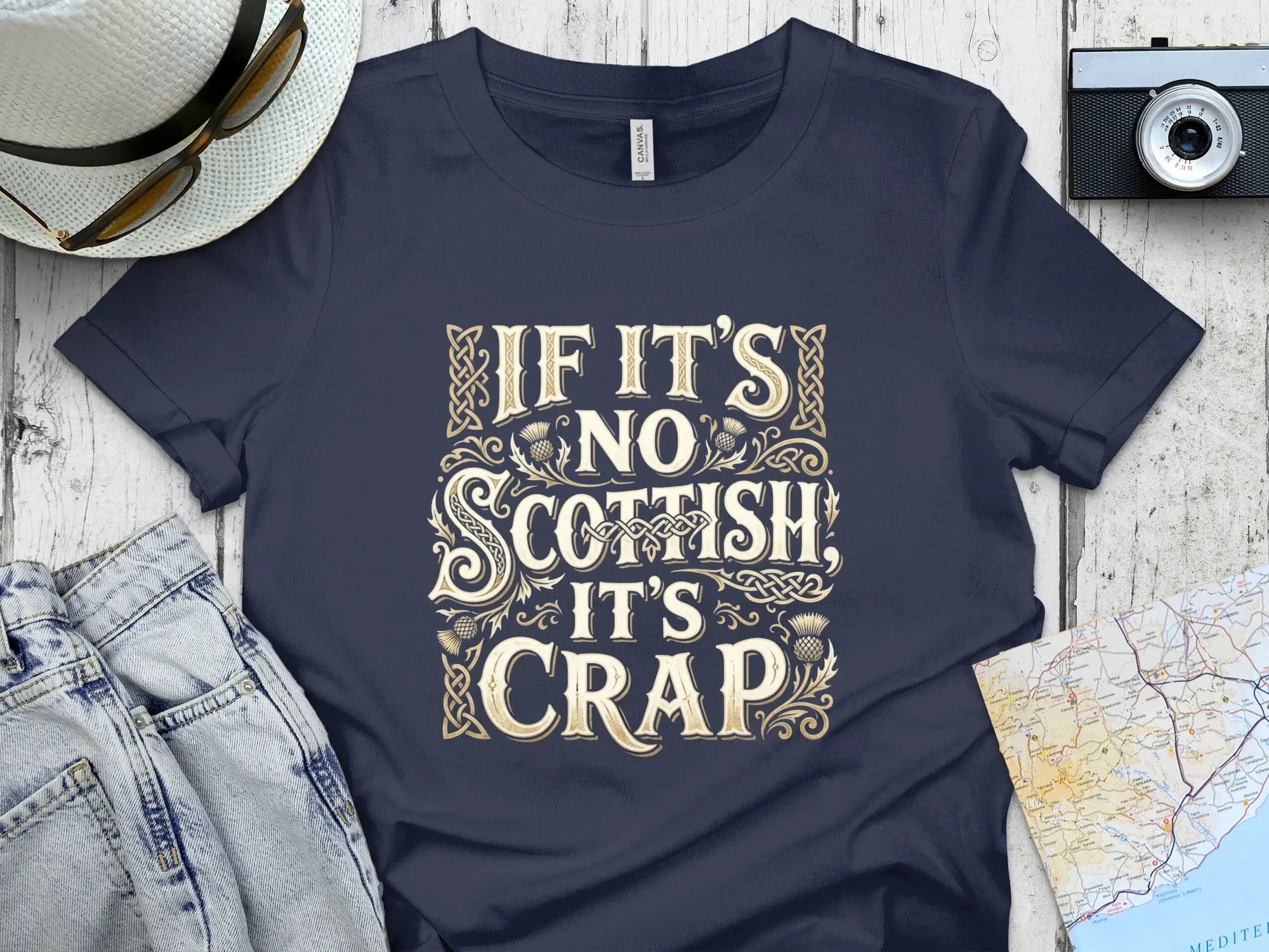 Navy t-shirt with "IF IT'S NO SCOTTISH IT'S CRAP" text in ornate font.