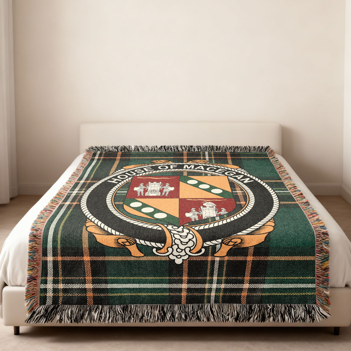 MacEgan family crest emblem woven blanket displayed on a bed