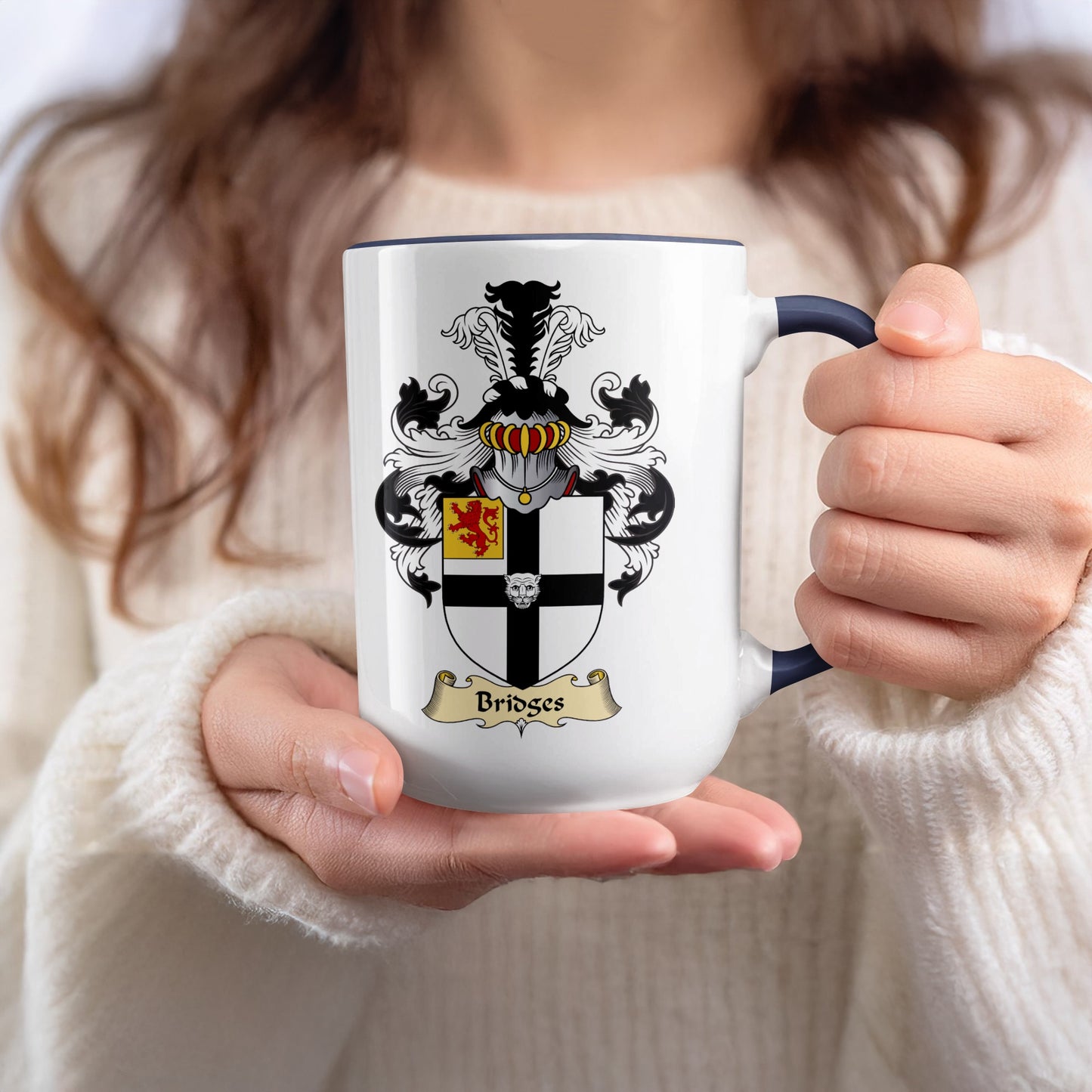 White mug with navy rim featuring the Bridges family crest.