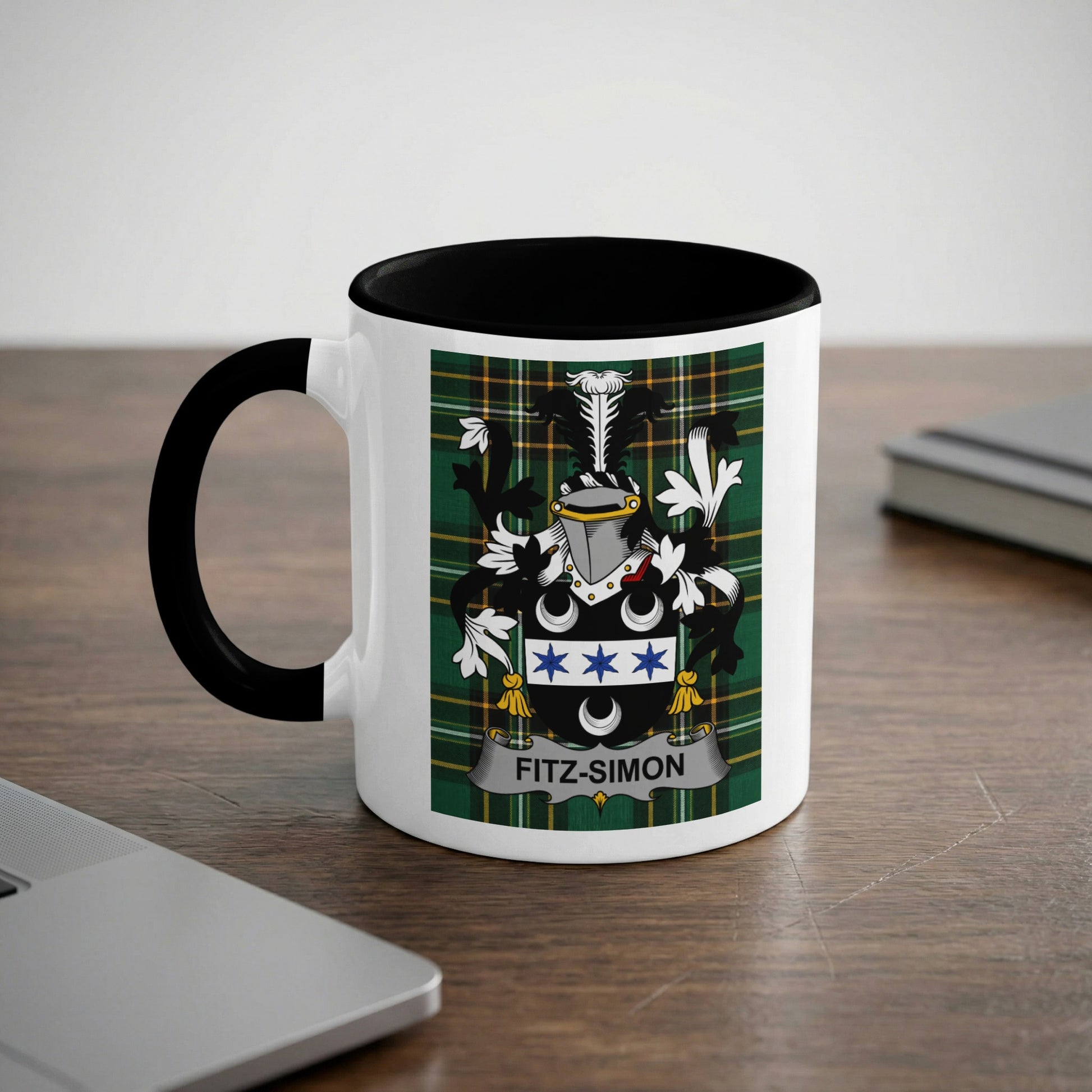 White mug with black handle featuring a green tartan and the Fitz-Simon crest.