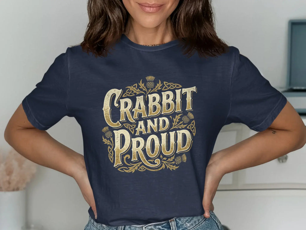 Navy t-shirt with gold "Crabbit and Proud" text and thistle designs.