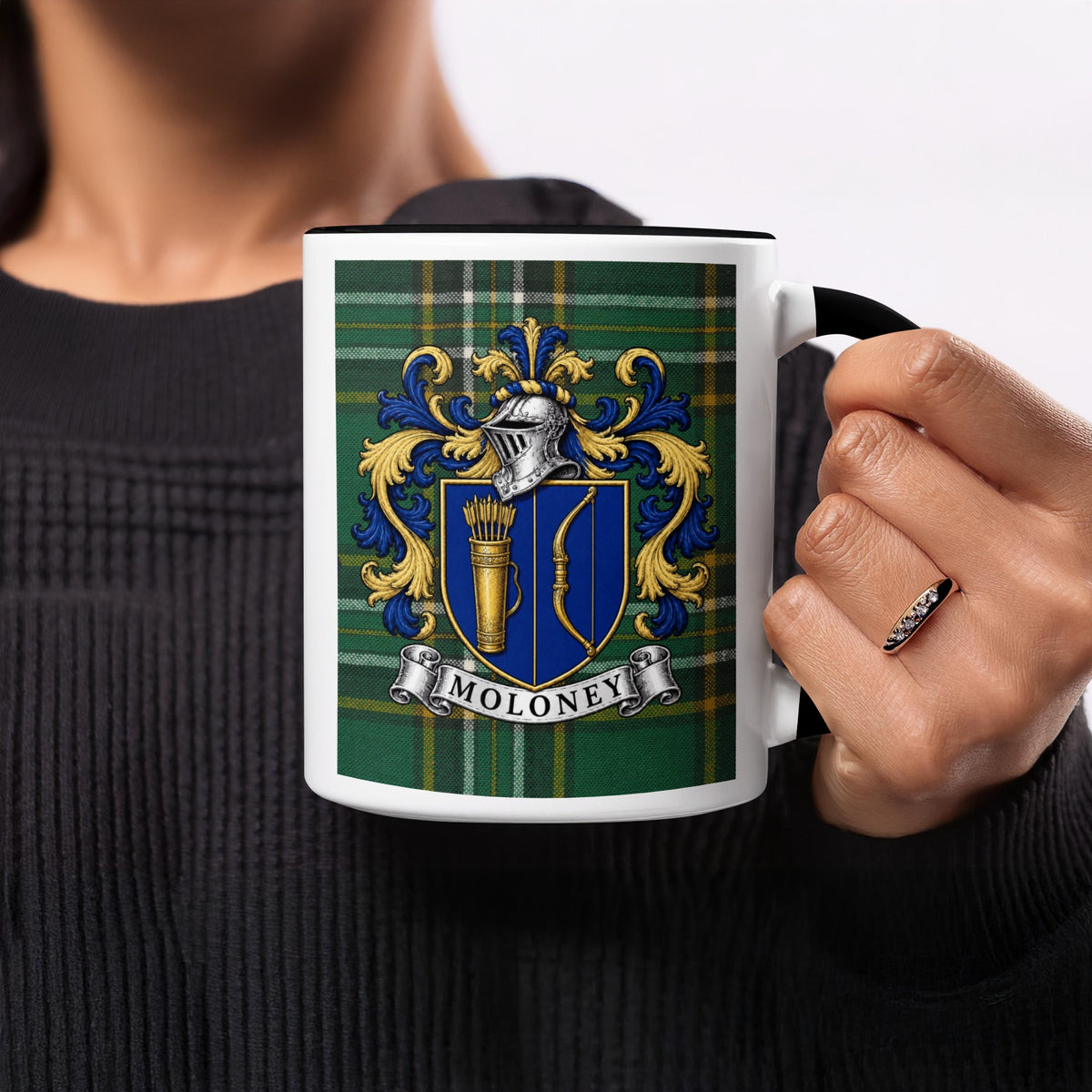 Moloney family crest on Irish National Tartan 11 oz ceramic mug, close-up view