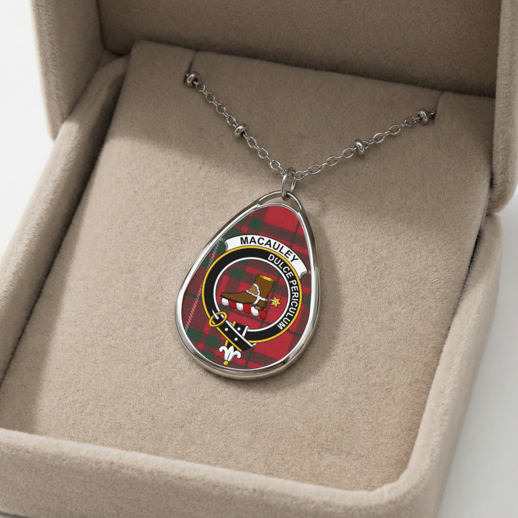 Oval pendant with Macaulay tartan, crest, and motto on a beaded necklace.