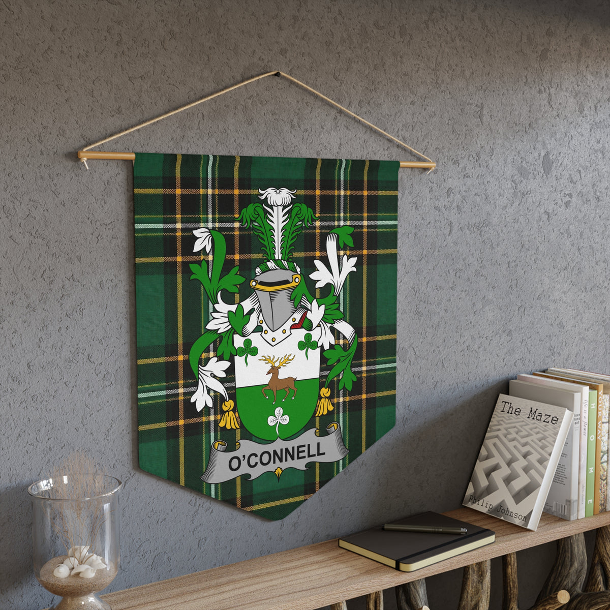 O'Connell family crest on a green plaid banner hanging on a wall.