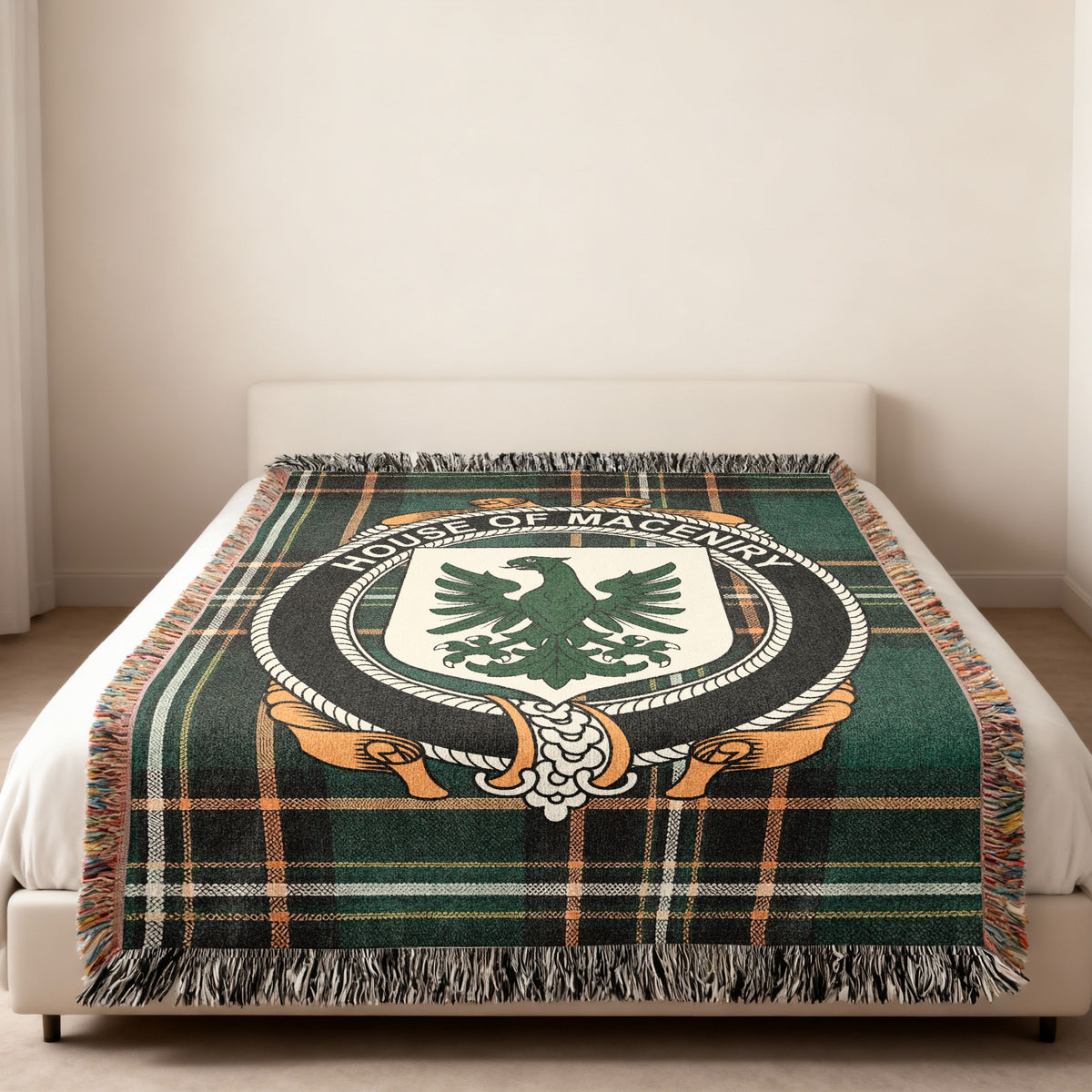 MacEniry family crest emblem woven blanket displayed on a bed