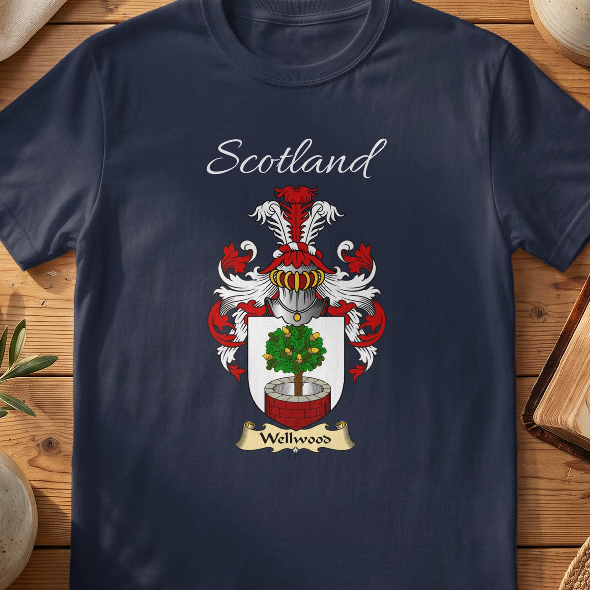 Navy Wellwood heritage T-shirt laid flat with “Scotland” and the colourful family shield design.