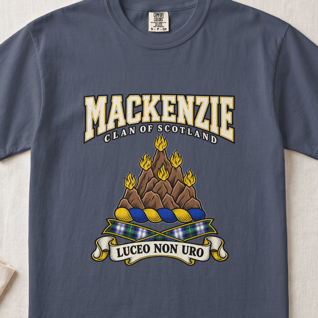 MacKenzie graphic T-shirt in Midnight blue, front flat lay showing varsity lettering and brown rocky mount with six gold flames.