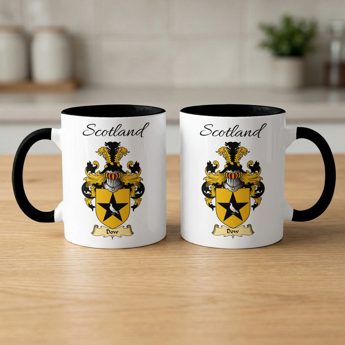 Two white Dow Scottish family shield mugs with black handles and interiors, artwork shown on both sides