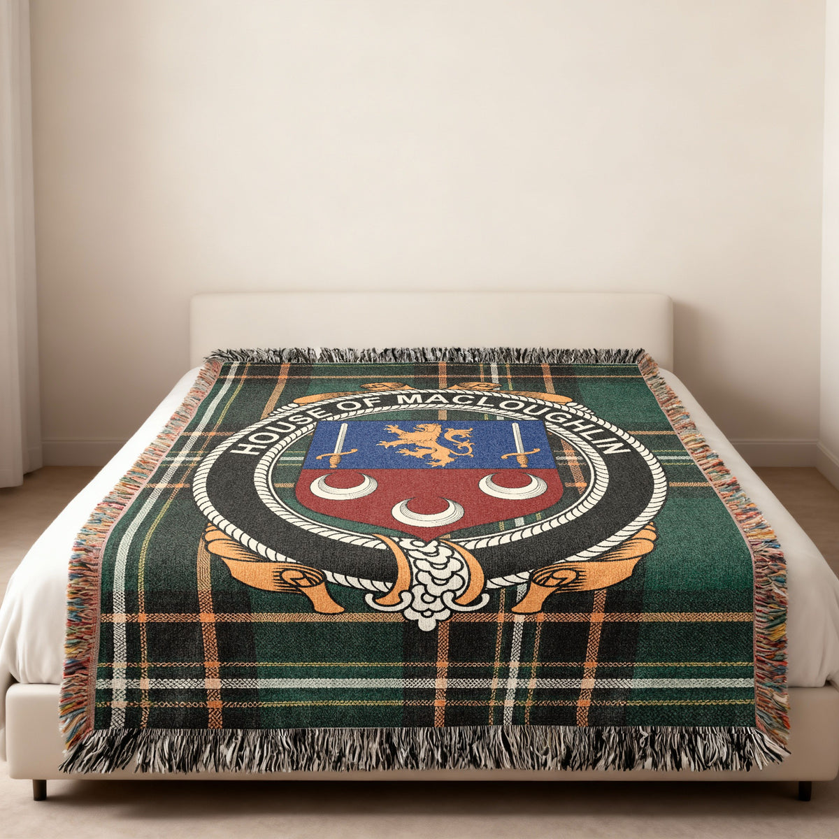 MacLoughlin family crest emblem woven blanket displayed on a bed