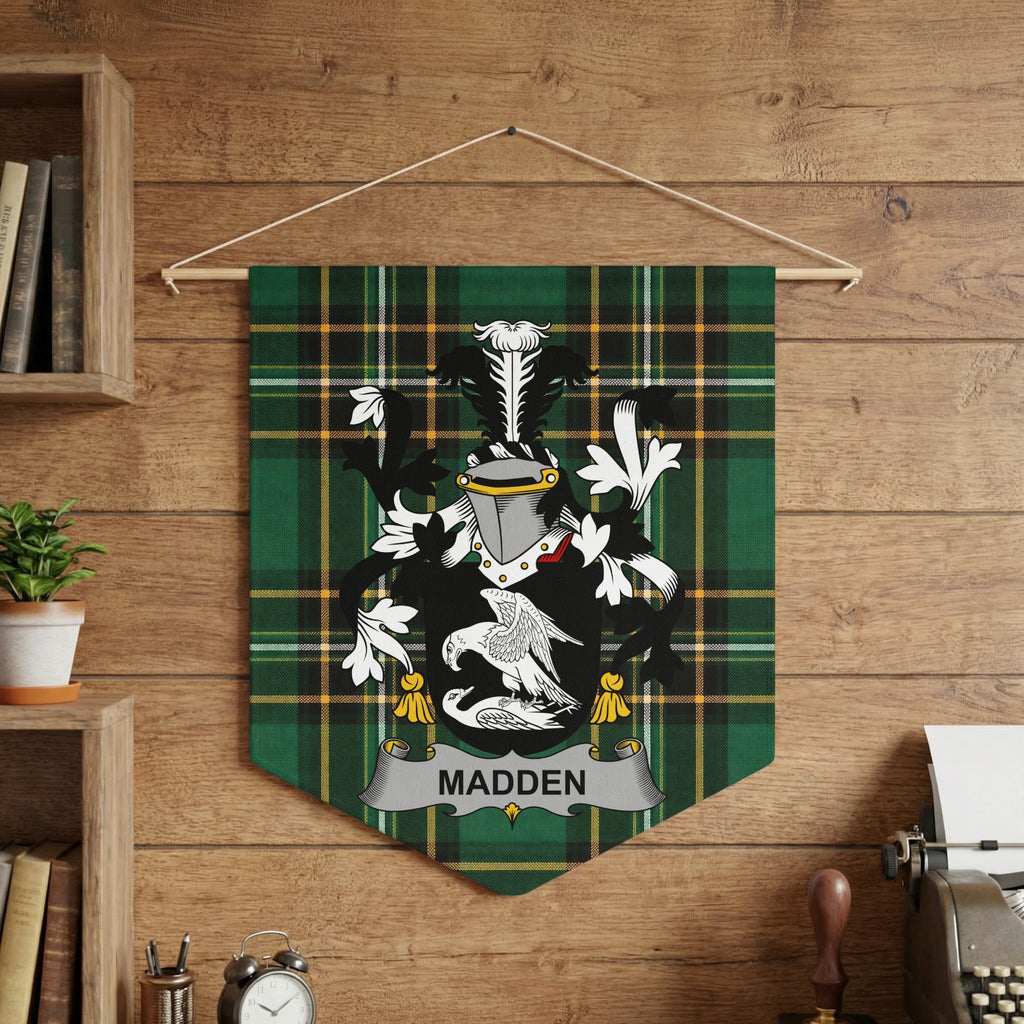 Madden family crest on green tartan banner hanging on wood-paneled wall.