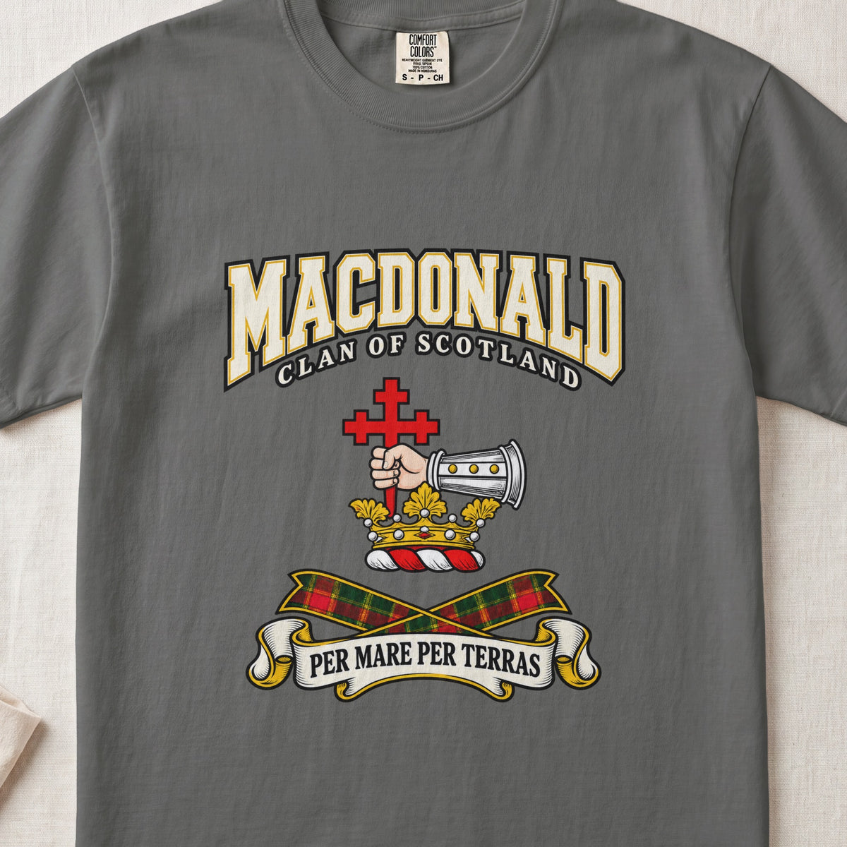 MacDonald graphic T-shirt in Pepper gray, front flat lay showing varsity lettering and armoured forearm with hand holding red cross.