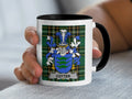 Mug with the Cotter family crest on a tartan background.