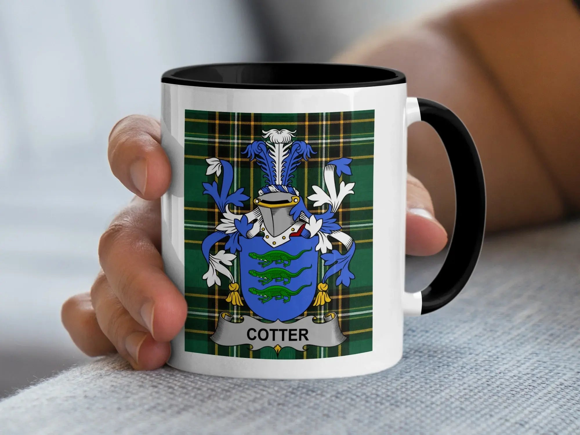 Mug with the Cotter family crest on a tartan background.