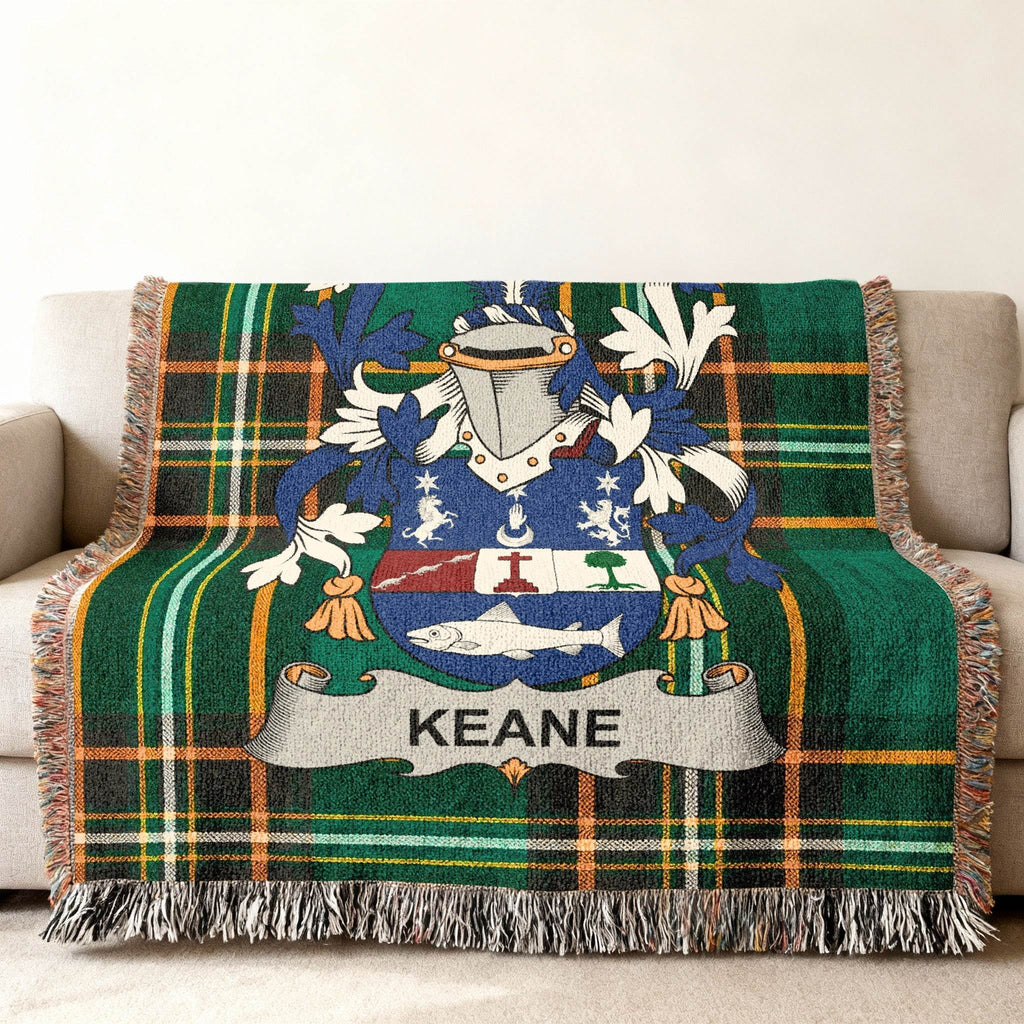 Keane family crest on a green plaid throw blanket.