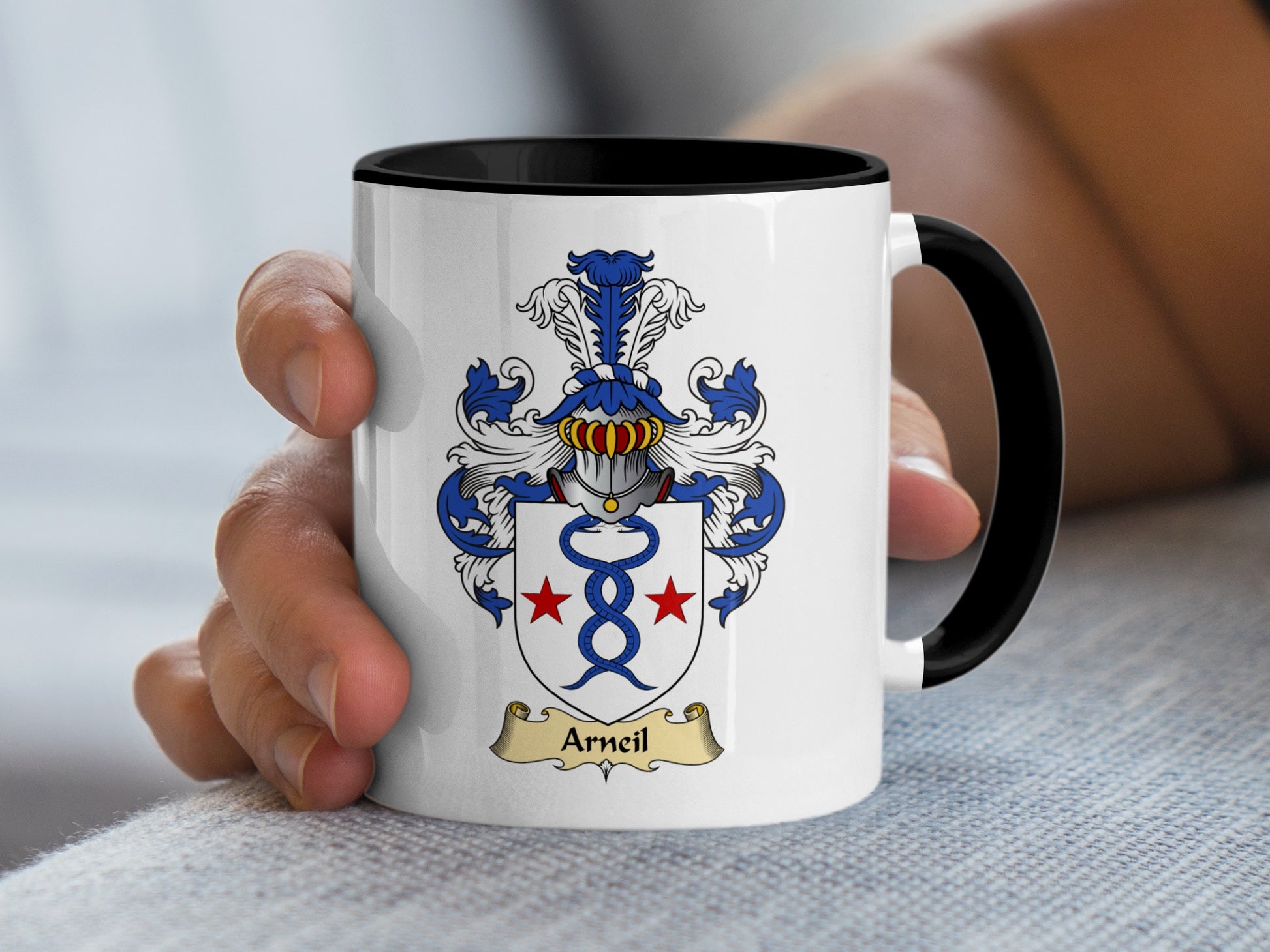 White mug with black rim displaying the Arceil family crest.