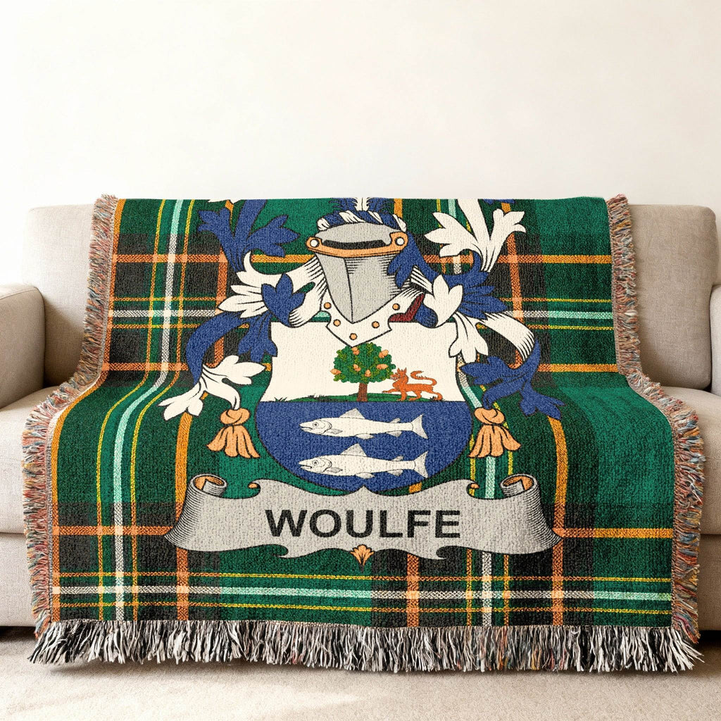 WOLFE family crest on a green and black plaid throw blanket.