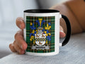 Mug with Warren family crest on tartan background.