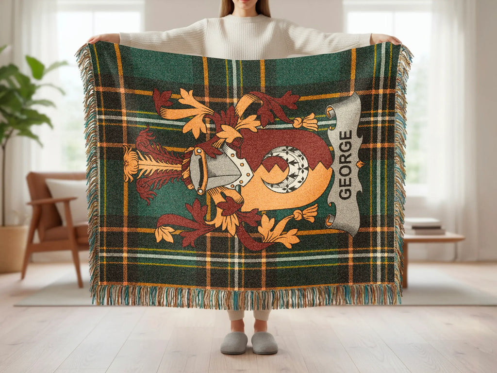 Tartan blanket with a family crest featuring the name "GEORGE".
