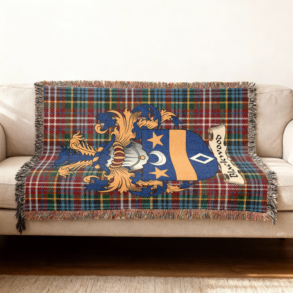 Blackwood family crest emblem on a Caledonia tartan woven blanket
