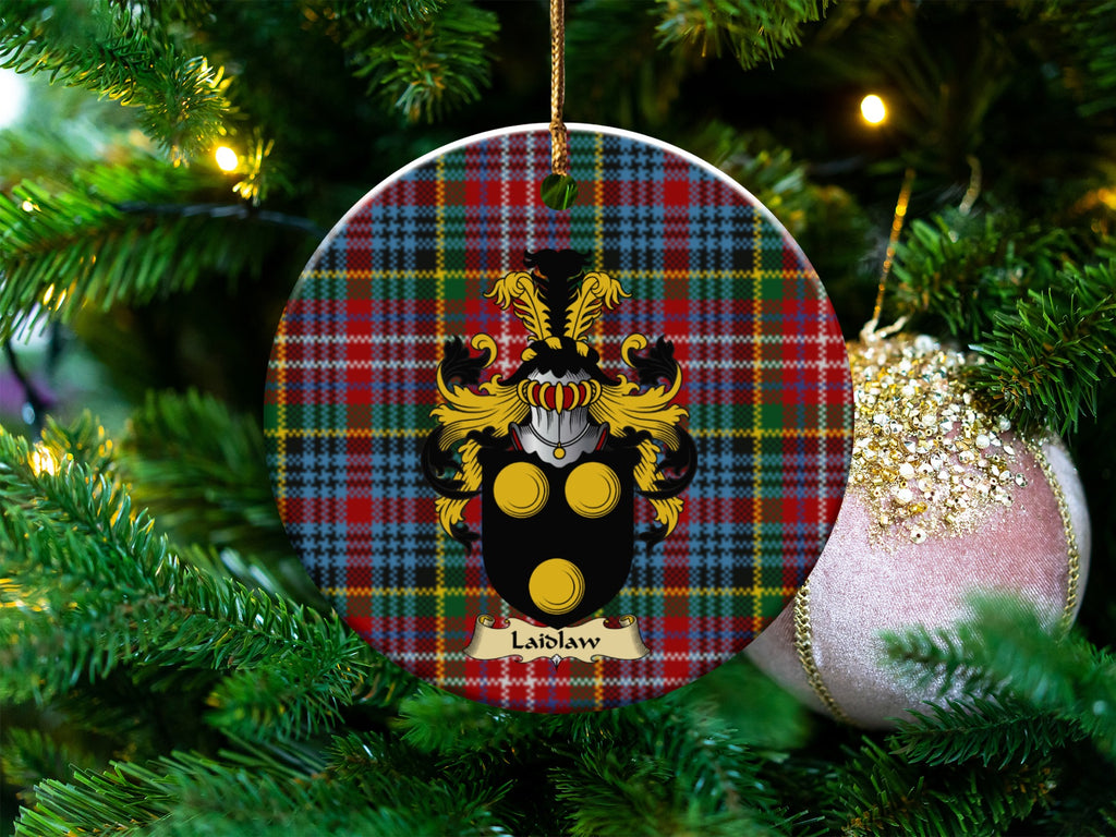Laidlaw Scottish clan ceramic ornament with family crest on a Caledonia tartan background, hanging on a Christmas tree