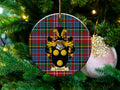 Laidlaw Scottish clan ceramic ornament with family crest on a Caledonia tartan background, hanging on a Christmas tree