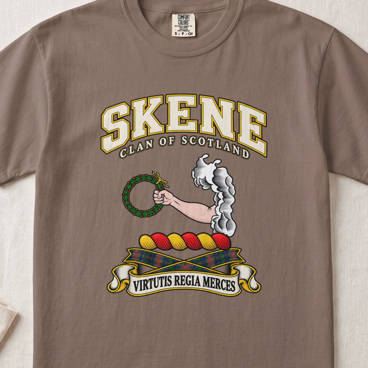 Skene Scottish clan T-shirt in Espresso, front view with an arm extending from clouds and holding a green wreath and motto design.