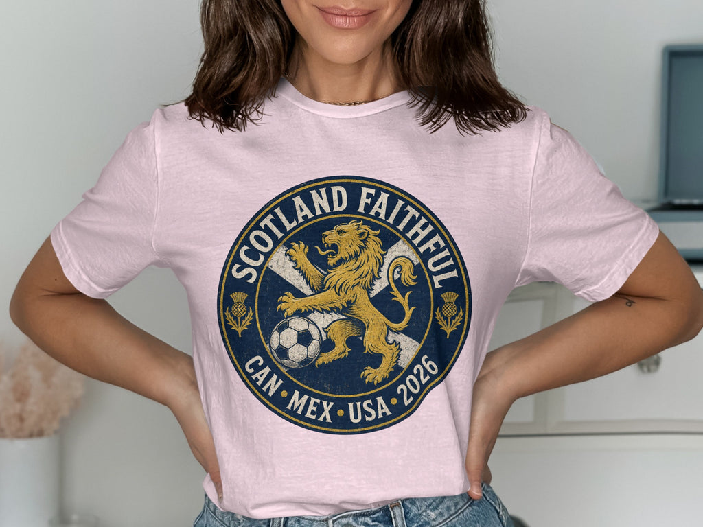Pink t-shirt with circular Scotland Faithful Can Mex USA 2026 graphic.