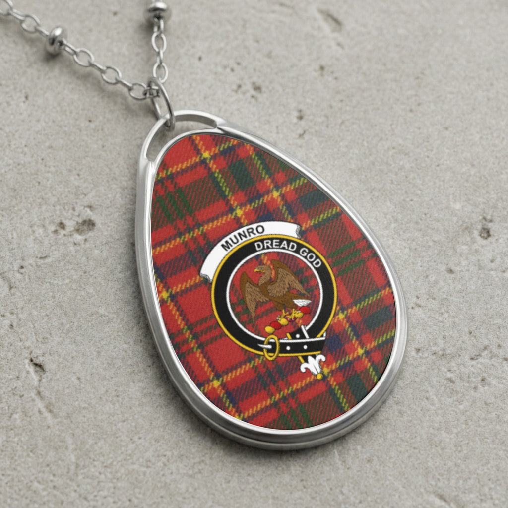Oval Munro clan crest necklace with plaid, eagle, and motto "Dread God."