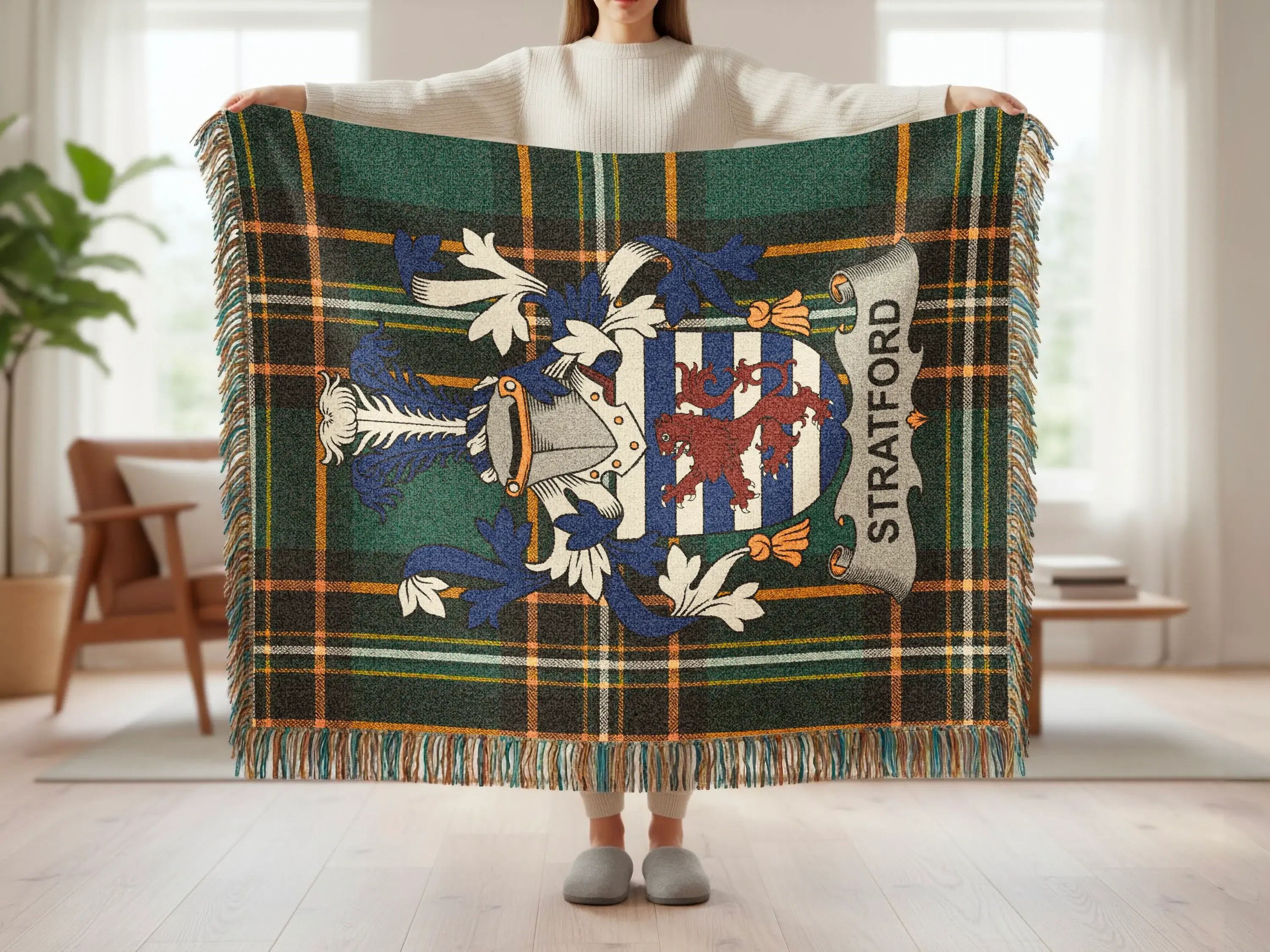 Green and blue plaid Stratford throw blanket with crest and fringe.