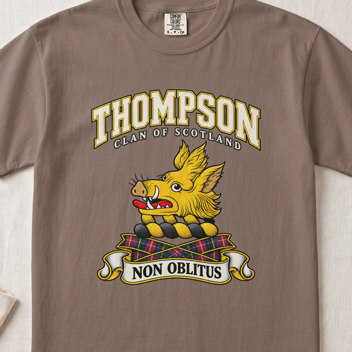 Thompson Scottish clan T-shirt in Espresso, front view with a golden boar head and motto banner.