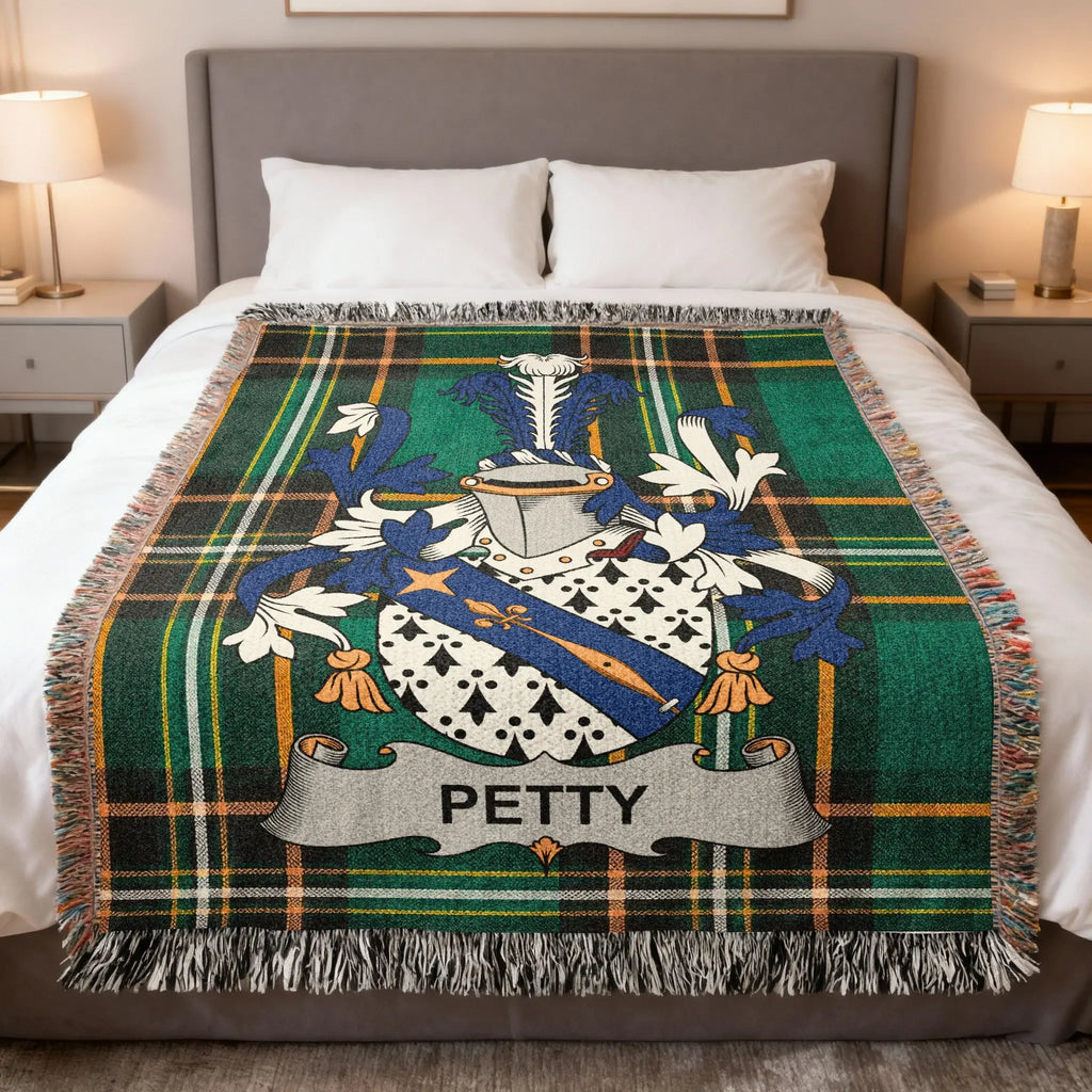 Green and blue tartan throw blanket with Petty family crest centered.