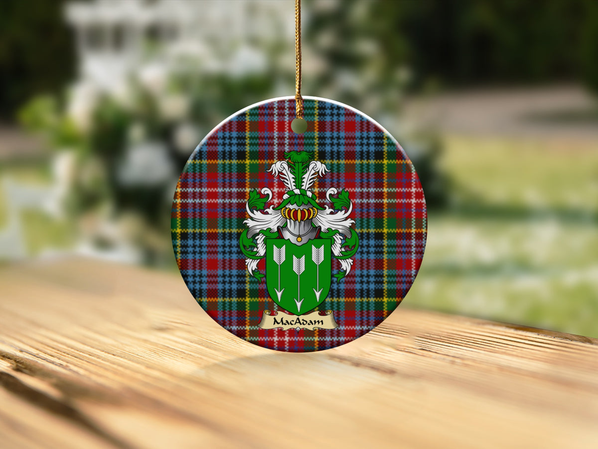Round MacAdam Scottish clan ornament with family crest on a Caledonia tartan background