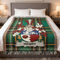 Tartan blanket with a family crest featuring "HENRY" across the shield.