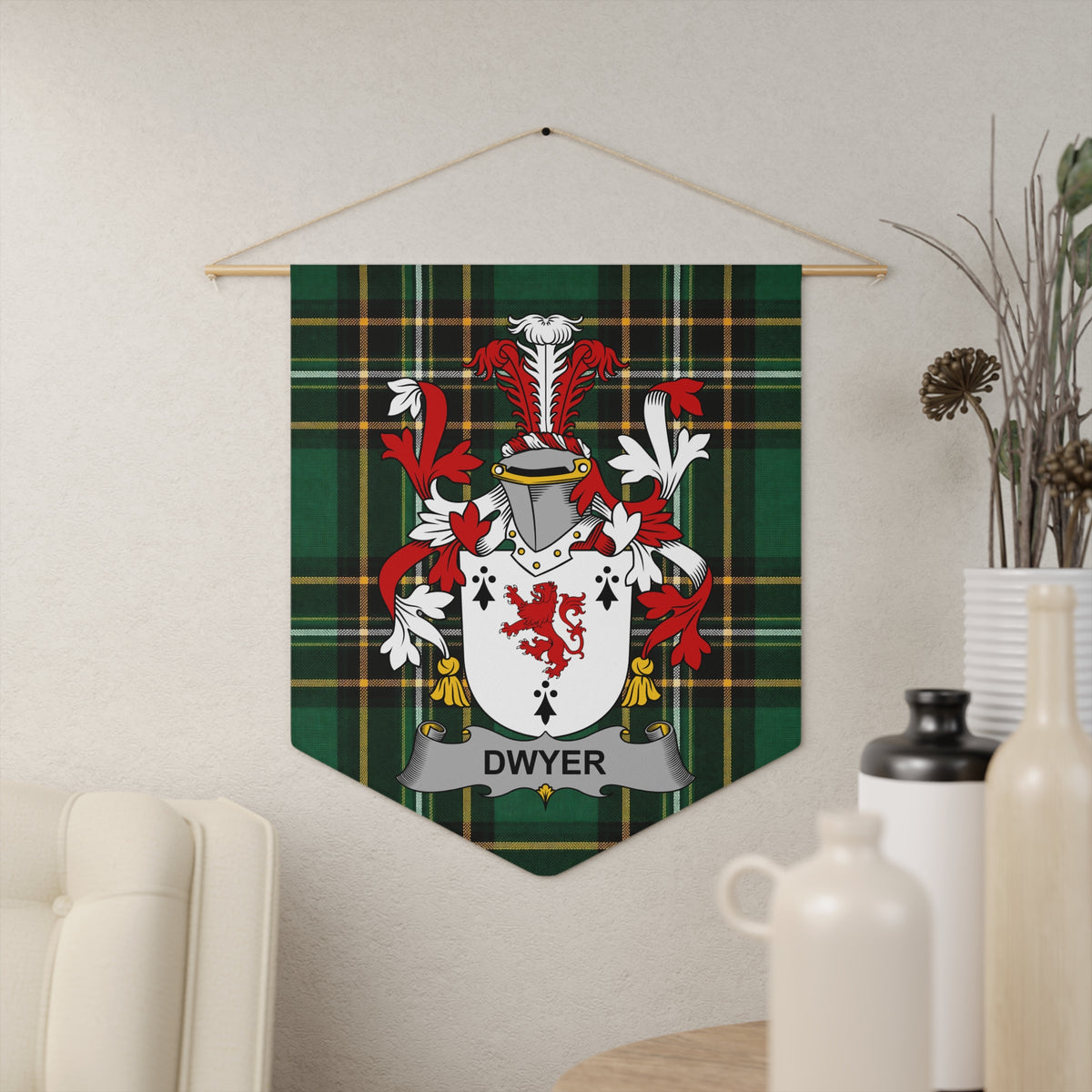 Dwyer family crest on green tartan banner hanging on wall, next to vases.