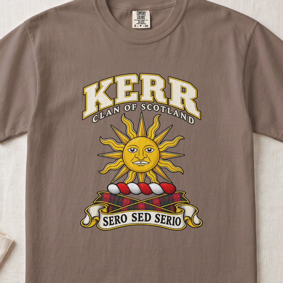 Kerr Scottish clan T-shirt in Espresso, front view with a golden sun with a face and motto banner.