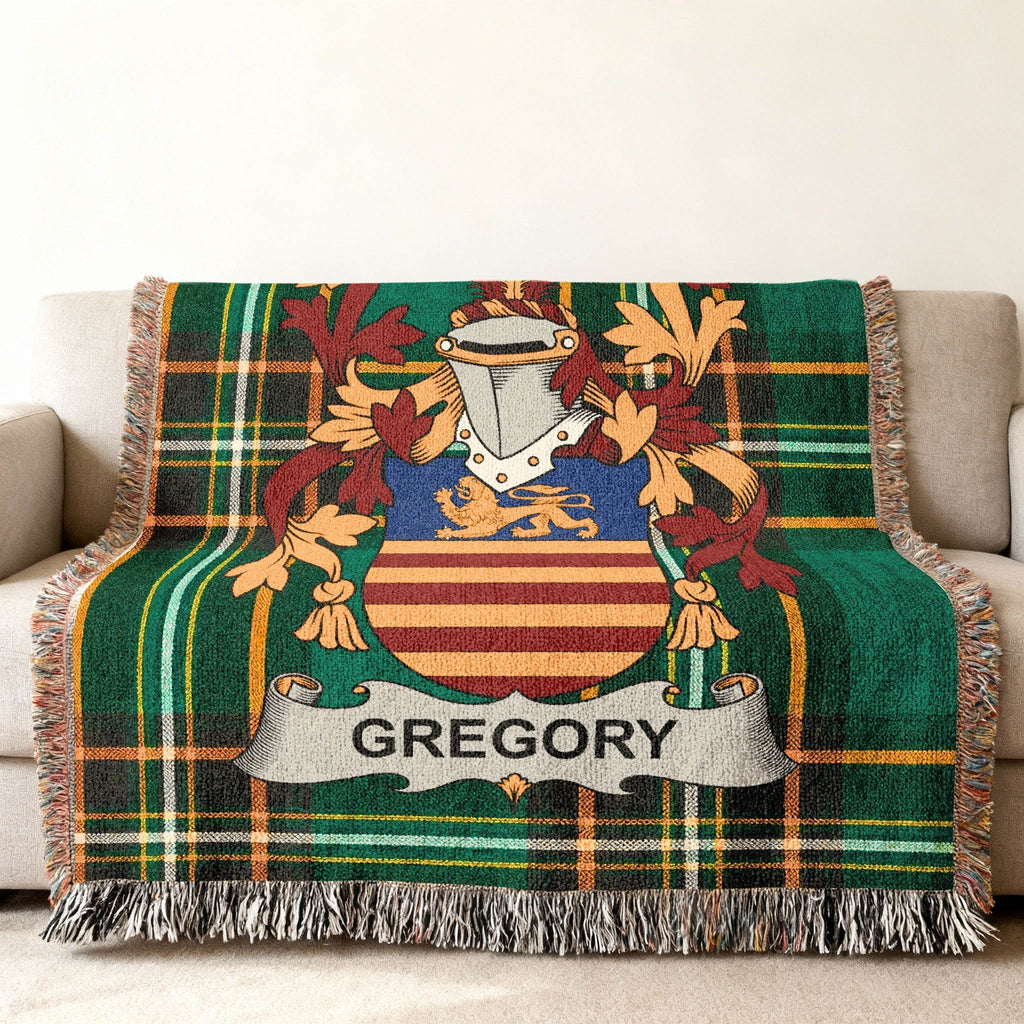 Green plaid throw blanket with the Gregory family crest displayed prominently.