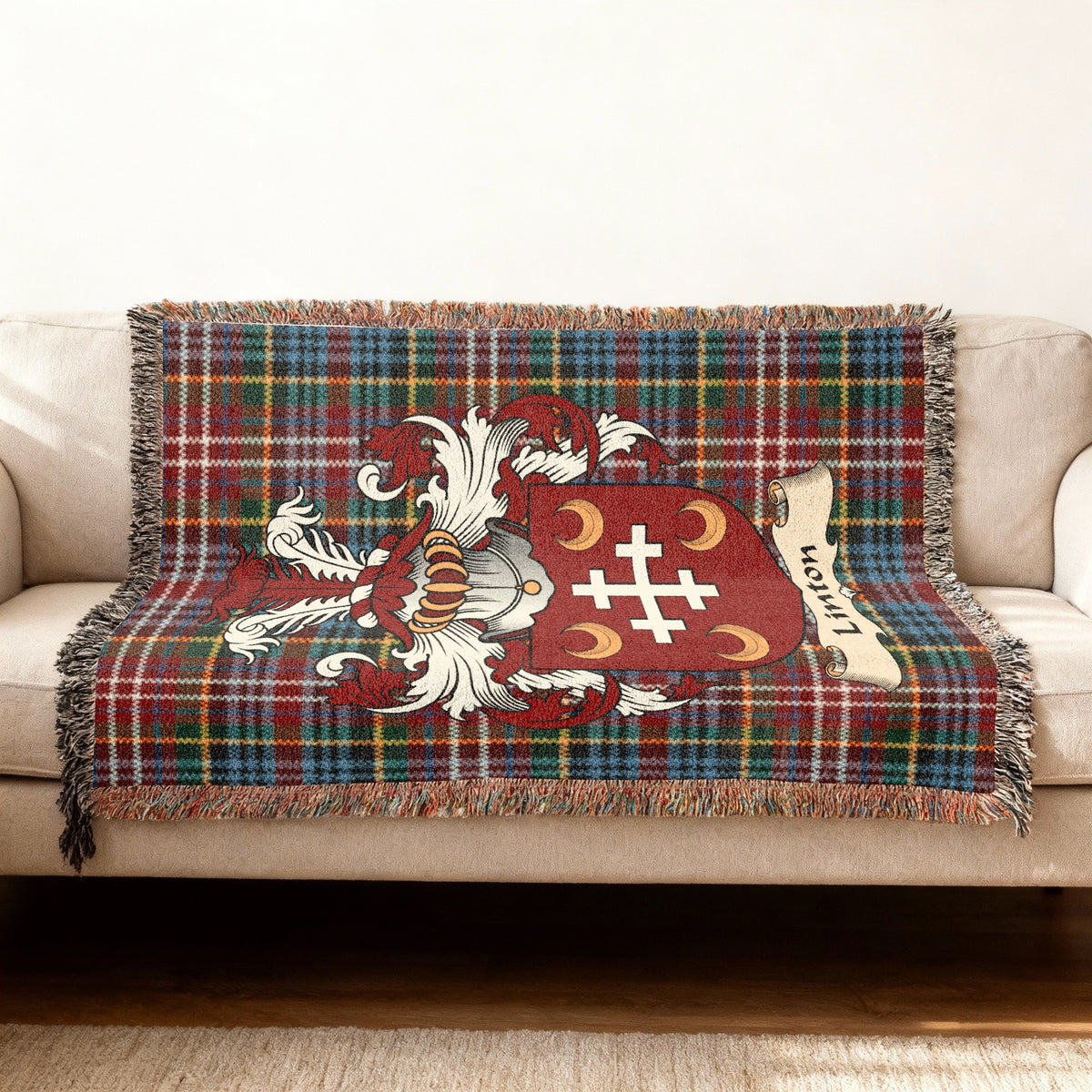 Linton Scottish woven blanket with family shield and Caledonia tartan background