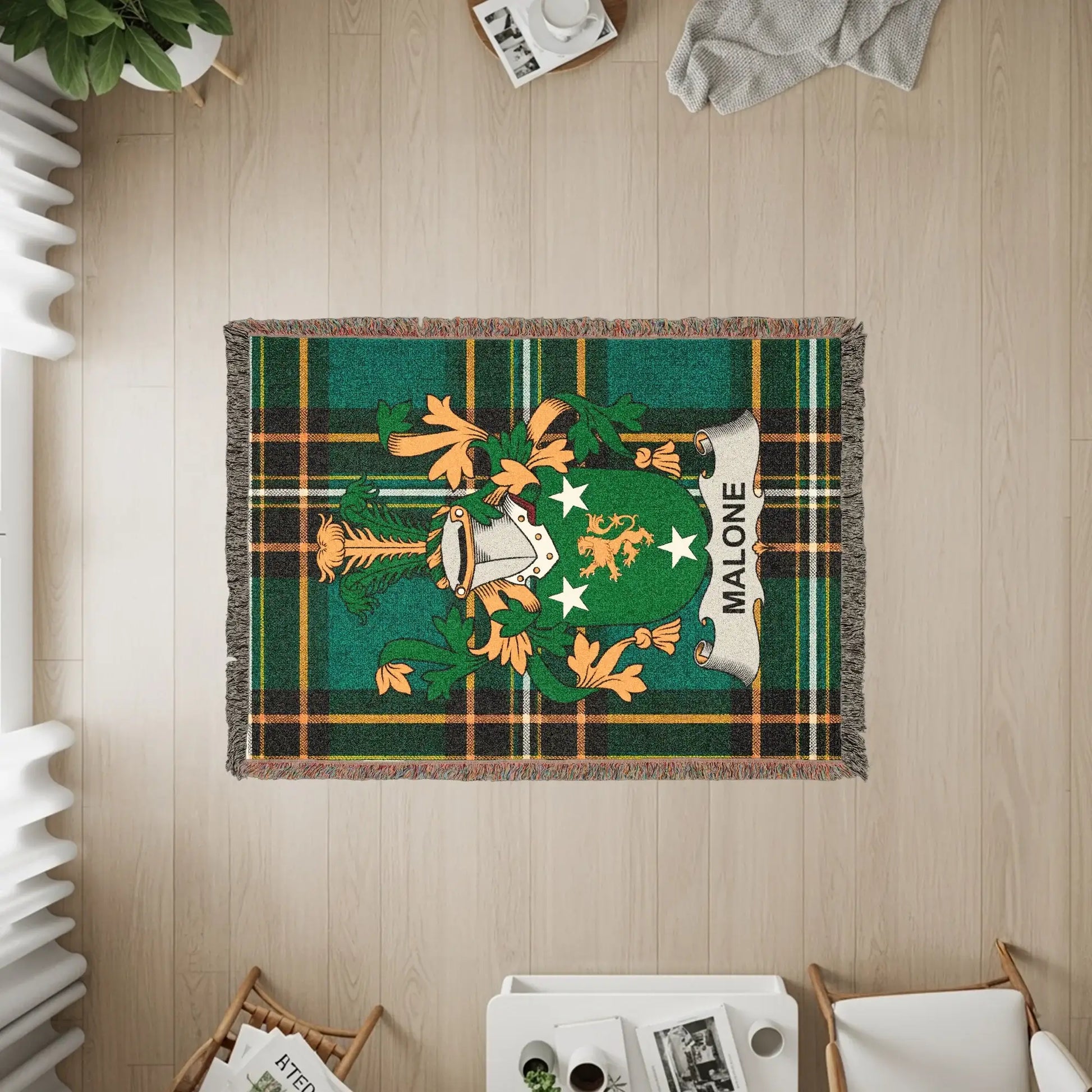 Malone family crest on a green plaid woven throw blanket.