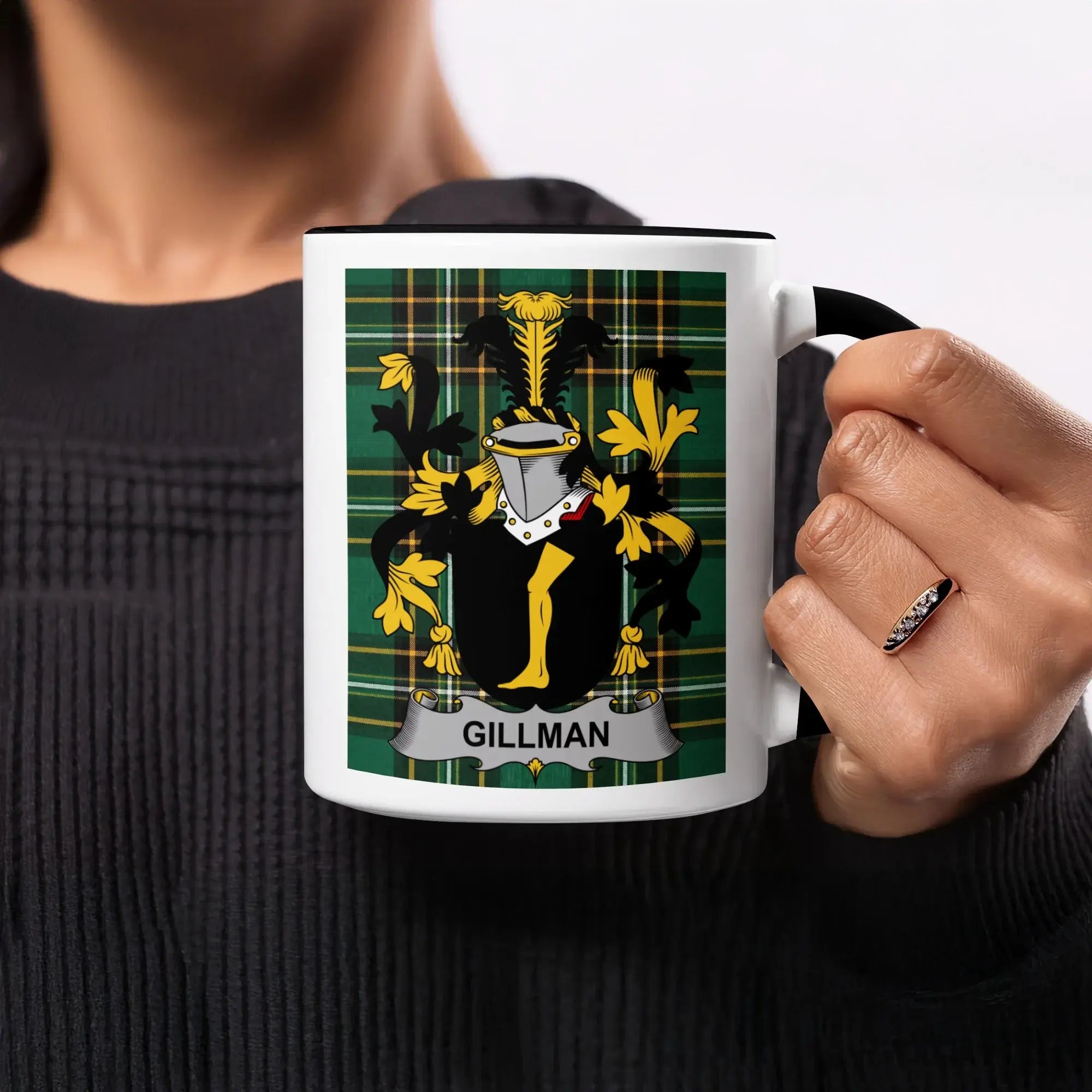 Mug with Gillman family crest on plaid background.