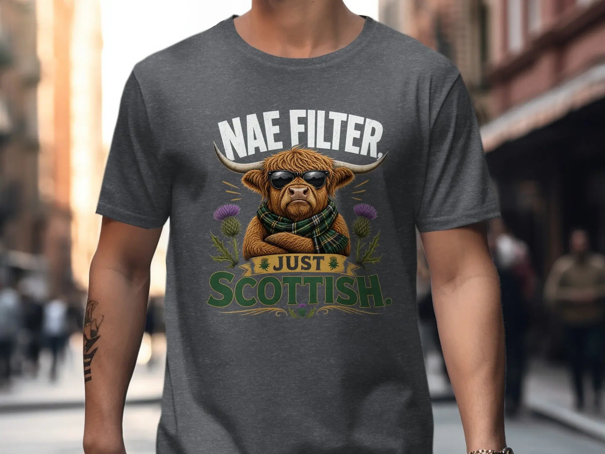T-shirt with "Nae Filter Just Scottish" text and sunglasses-wearing highland cow graphic.