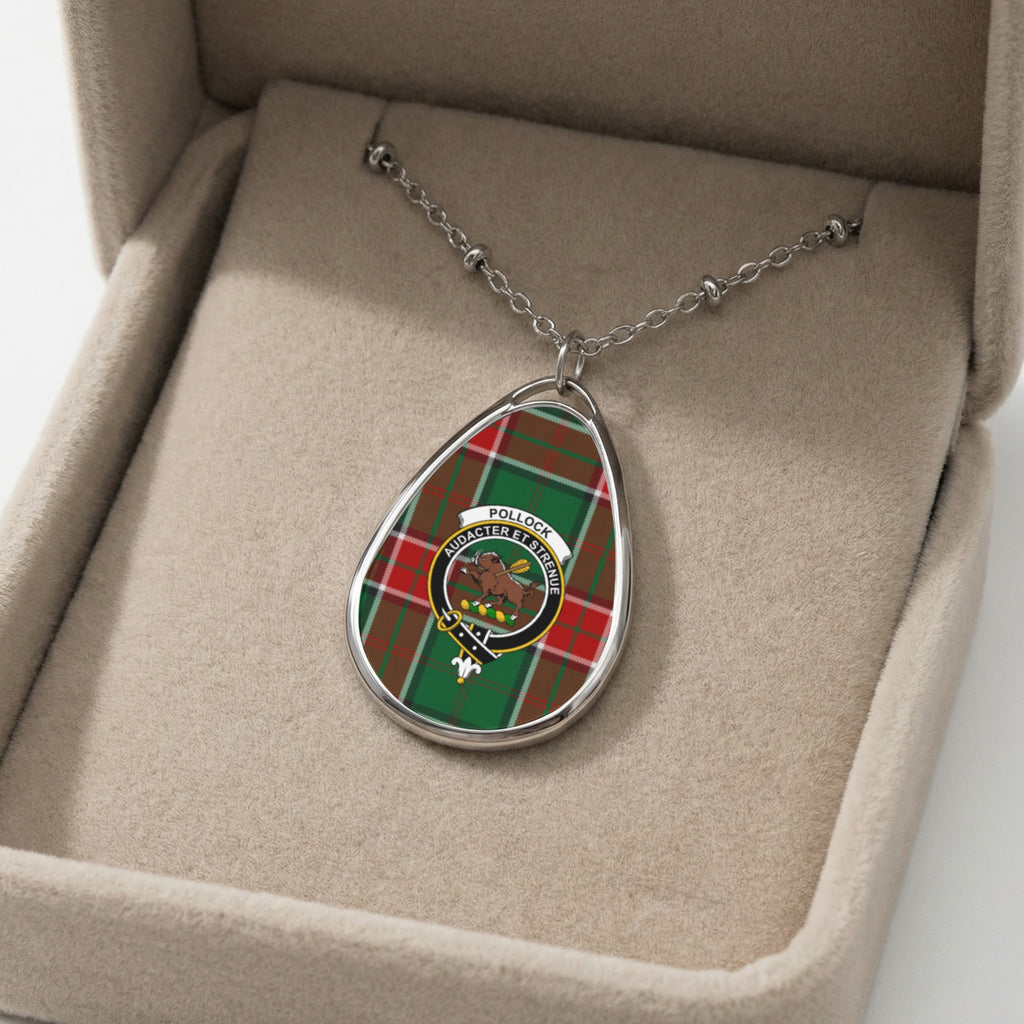 Pendant necklace with Pollock tartan and crest, displayed in a beige jewelry box.