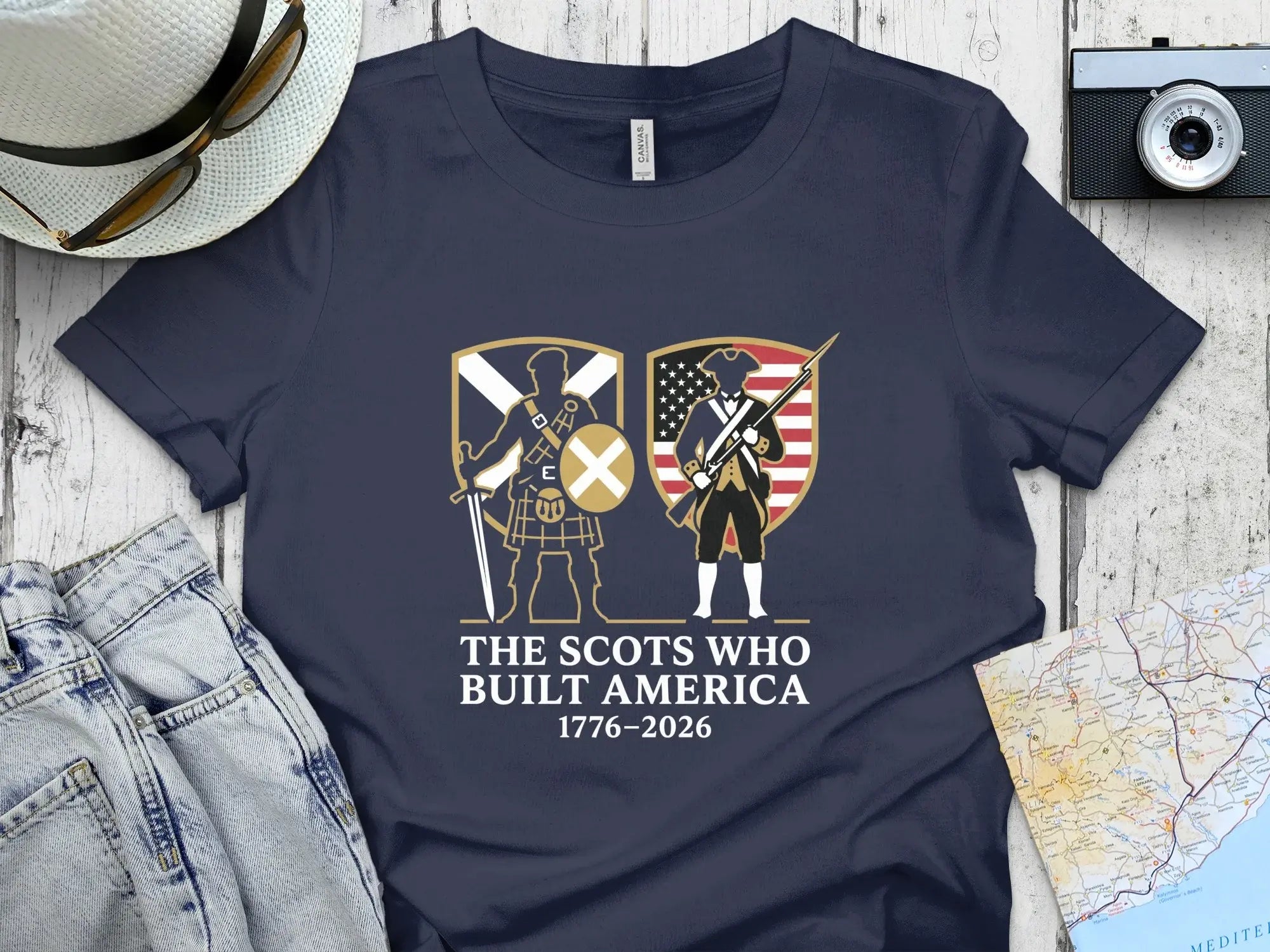 T-shirt with Scottish and American figures and "The Scots Who Built America" text.