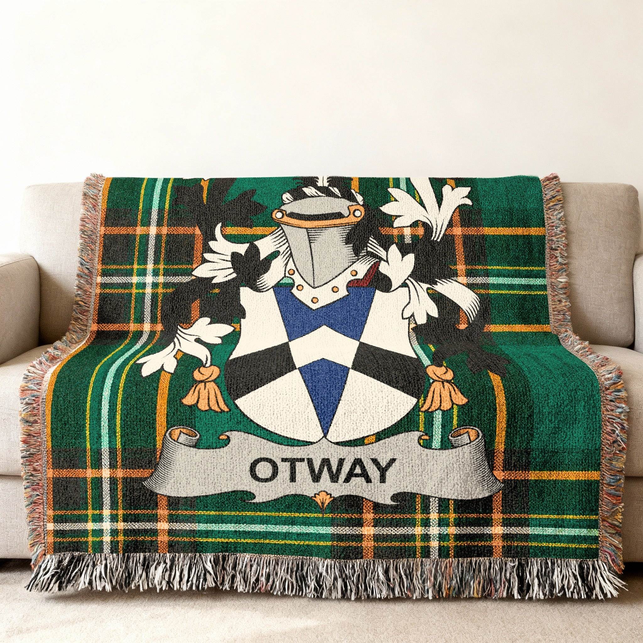 Green tartan throw blanket with Otway family crest.