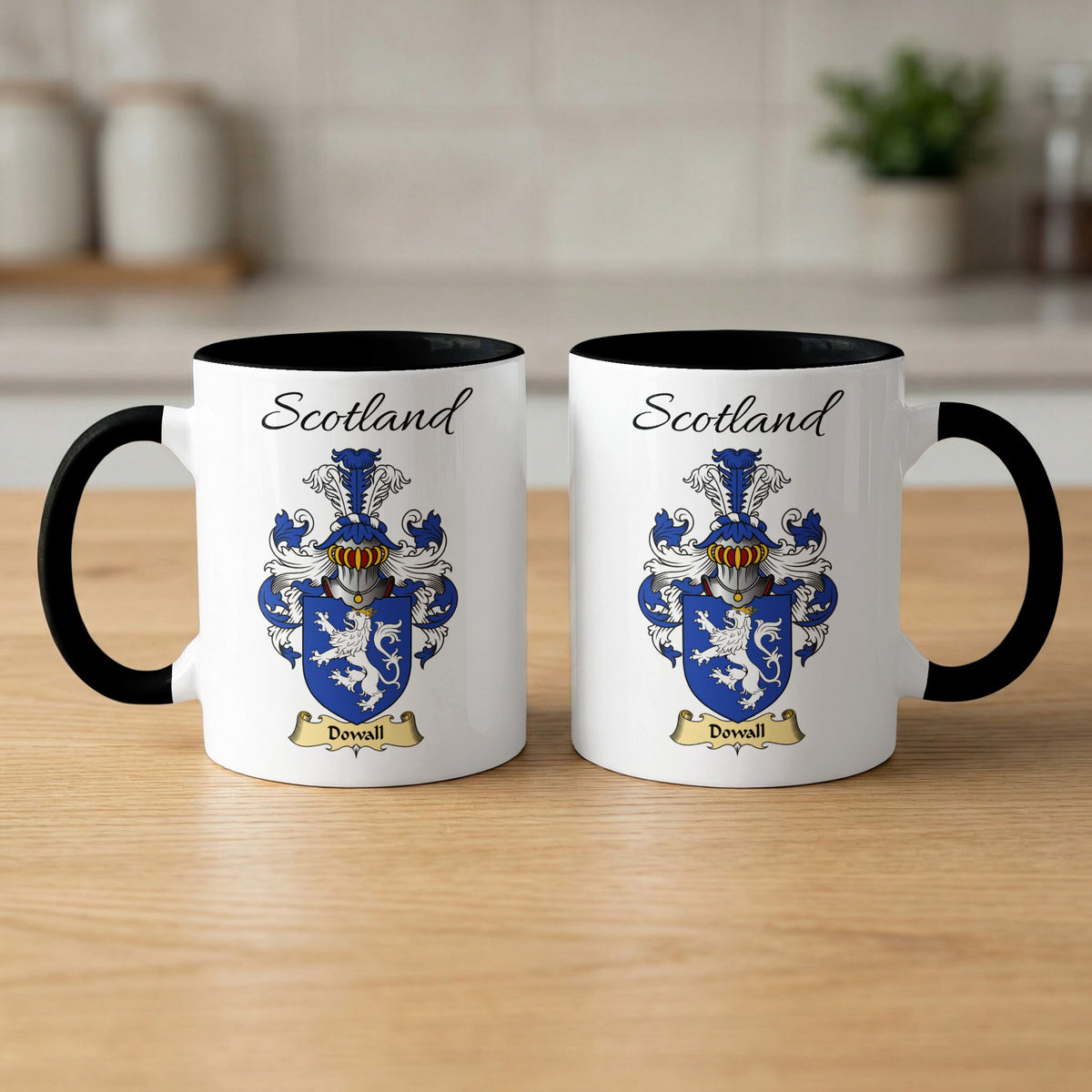 Two white Dowall Scottish family shield mugs with black handles, artwork shown on both sides