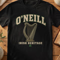 O'Neill Irish harp T-shirt in Black, with cream surname lettering, a gold-toned harp, green shamrock and “Irish Heritage” text.
