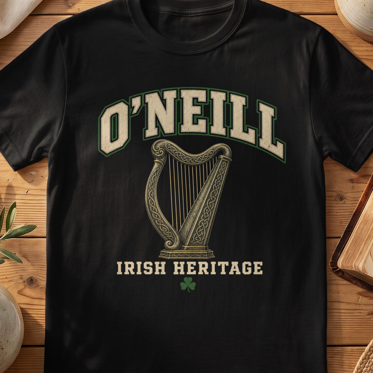 O'Neill Irish harp T-shirt in Black, with cream surname lettering, a gold-toned harp, green shamrock and “Irish Heritage” text.